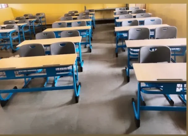 Image depicting a classroom with Benches and Desks